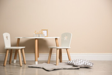 Baby room interior with stylish table and chairs