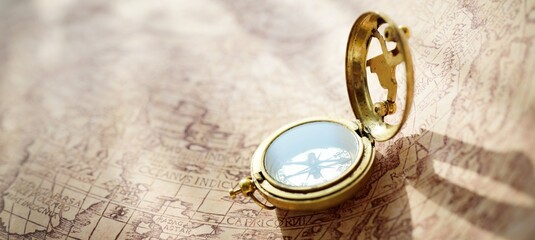 Retro styled golden compass (sundial) and old white nautical chart. Vintage still life. Sailing accessories. Travel, navigation, collecting, 3D modeling, souvenir, gift, graphic resources, copy space