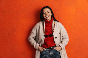 Young hispanic woman laughing and looking at camera