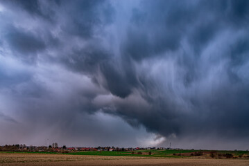 Obraz na płótnie Canvas storm clouds over the field