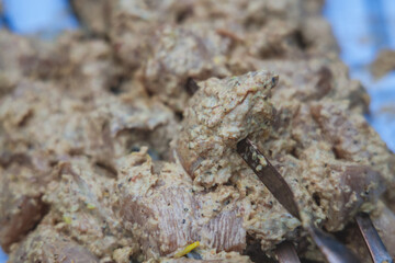 Cooking meat on coals outside. selective focus. Grilled meat background. Grilled shish kebab on the gri