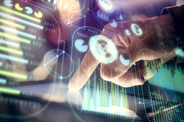 Obraz premium Multi exposure of man's hand holding and using a digital device and data theme drawing. Innovation concept.