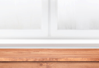 Wooden table in a kitchen. Window with empty tabletop as template. Interior with brown shelf.