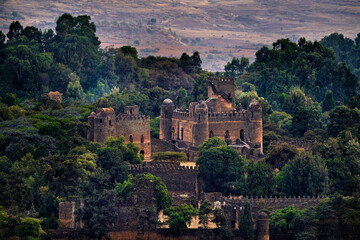 Aerial view at Fasilides castle in Gondar in Ethiopia. Green trees with old building in Africa...