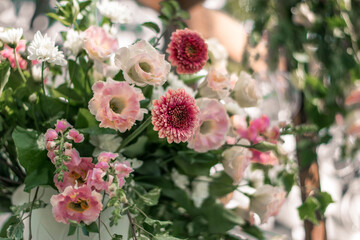 Close up of flower arrangement for wedding main table at a wedding reception.