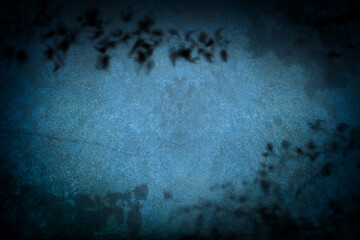 Abstract dark blue background with organic shapes and shadows. Rough texture