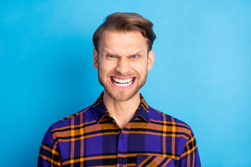 Photo of angry man crazy unhappy young man bad mood conflict isolated on pastel blue color background