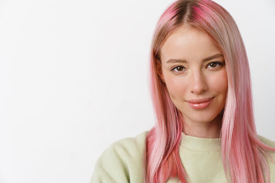 Young White Woman With Pink Hair Smiling And Looking At Camera