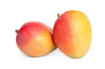 Delicious ripe juicy mangoes on white background