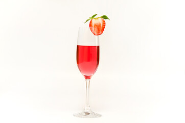 a glass of pink wine cocktail decorated with strawberries
