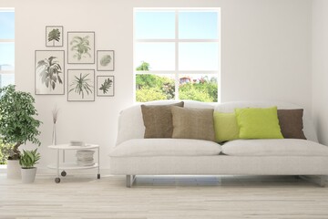 White living room with sofa and summer landscape in window. Scandinavian interior design. 3D illustration