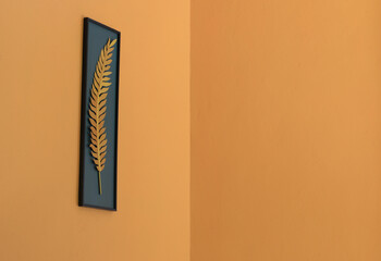 orange wall with palm leaf pattern