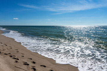 Sea coast. Waves and storms at sea. Waves on the Baltic Sea. Sea waves in the sunlight.
