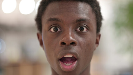 Close up of Shocked Young African Man Face, Wondering