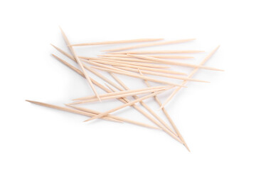 Heap of wooden toothpicks on white background