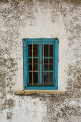 A blue wooden traditional turkish window - closed - shut - white wall as a background with blank space for text