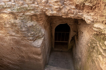The entrance  to the economic cave - columbarium - a dovecote near the excavations of the ancient Maresha city in Beit Guvrin, near Kiryat Gat, in Israel