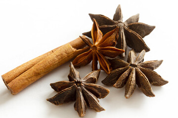 Dried Herbs and Spices: Cinnamon sticks and star anise isolated on white background.