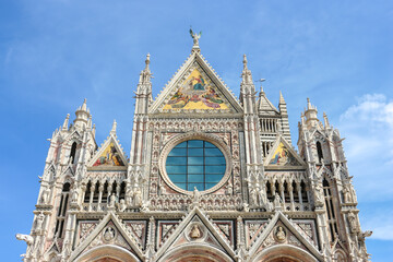 Fototapeta na wymiar Siena, Italy. Beautiful view of Siena Cathedral (Duomo di Siena) in sunny day.