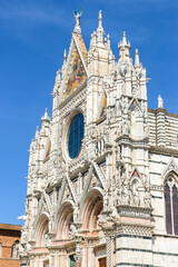 Fototapeta na wymiar Siena, Italy. Beautiful view of Siena Cathedral (Duomo di Siena) in sunny day.