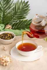 tea ceremony, brewing black tea in a teapot
