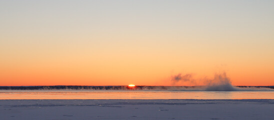Winter sunrise steam fog