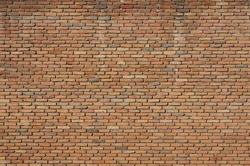 Old brick wall. Brickwork from an old brick in a rustic style. The structure and pattern of the destroyed stone wall. Copy space 