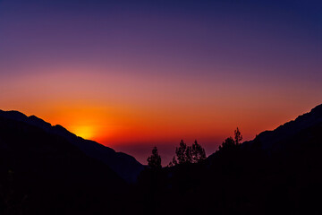 bright sunset in the mountains on a summer evening