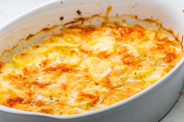 still ife of baked potatoes with cheese