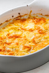 still ife of baked potatoes with cheese