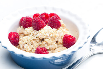 still life of porridge with raspberries