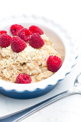 still life of porridge with raspberries