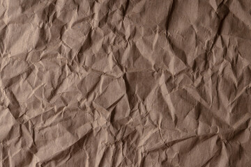 crumpled paper.sheet of brown cardboard paper. detailed high resolution texture. abstract background for wallpaper.
