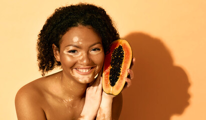 Papaya cosmetics for depigmentation of a woman's skin face with vitiligo. Skin care with features,...