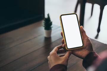 cell phone blank white screen mockup.woman hand holding texting using mobile on desk at office.background empty space for advertise.work people contact marketing business,technology