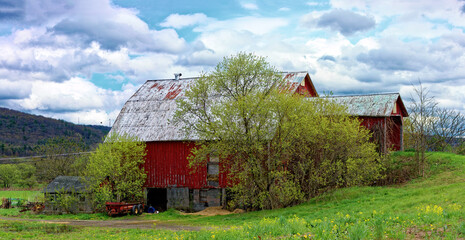 red barn in sSpring in the small town of Windsor in Broome County in Upstate NY.  White and Red. ...