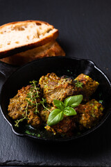 Food concept homemade spot focus roasted grilled satay beefs in skillet iron pan with copy space