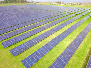 Drone view of a solar power plant on a sunny day. Solar farm system with a drone. A source of ecological renewable energy