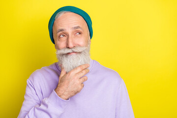 Photo of tricky thoughtful mature man dressed purple pullover arm chin smiling looking empty space...