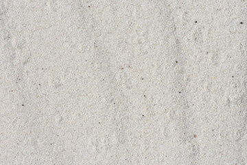 Sandy background. Sand texture with raindrops. Natural backdrop