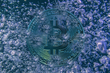 blue bitcoin crypto currency with lot of air bubbles before bursting