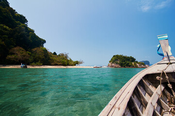 Obraz premium Travel by Thailand. Bow of traditional thai wooden longtail boat sailing the sea.
