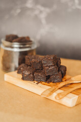 fudgy brownies bites on a wooden board