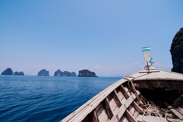 Travel by Thailand. Bow of traditional thai wooden longtail boat sailing the sea.