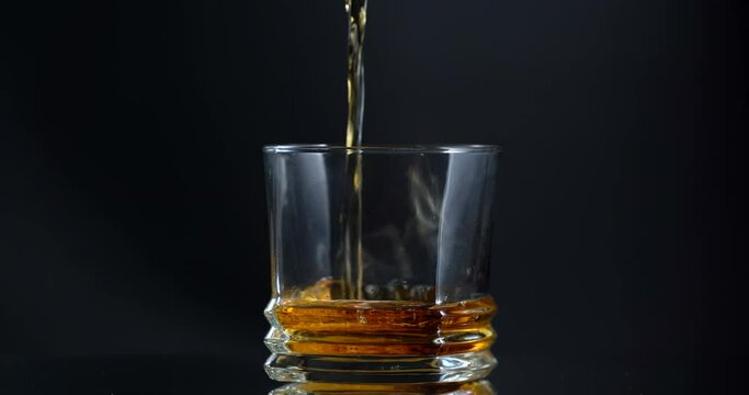 Super Shot of Pouring Whiskey into empty Glass