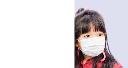 Coronavirus Covid-19.kid with mask.online education.Empty mock up white background.Little asian girl wearing face mask at home.Covid-19 coronavirus.vaccine.Social distancing.School kid with mask.