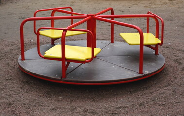 Small triple red and yellow children's carousel