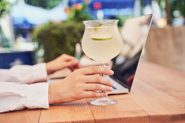 Close up of pritty business woman drinking cocktail