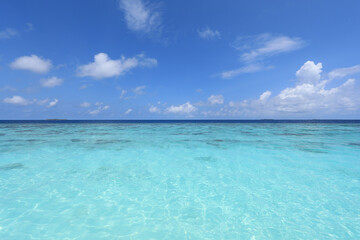 paradise idyllic seascape in the Indian Ocean, turquoise water and blue sky