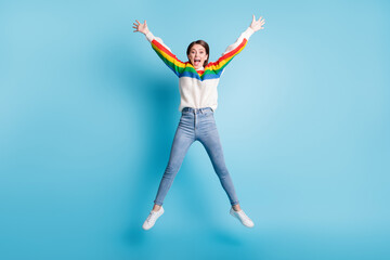 Fototapeta na wymiar Full length body size view of pretty fit girlish cheerful girl jumping like star having fun isolated over bright blue color background